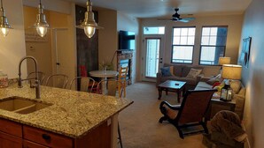 A kitchen with granite countertops, a built-in sink, and pendant lighting. - Granby Ranch Ski Condo with King Bed & Bunkbed! (Granby)