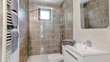 Shower, hair dryer, towels, soap