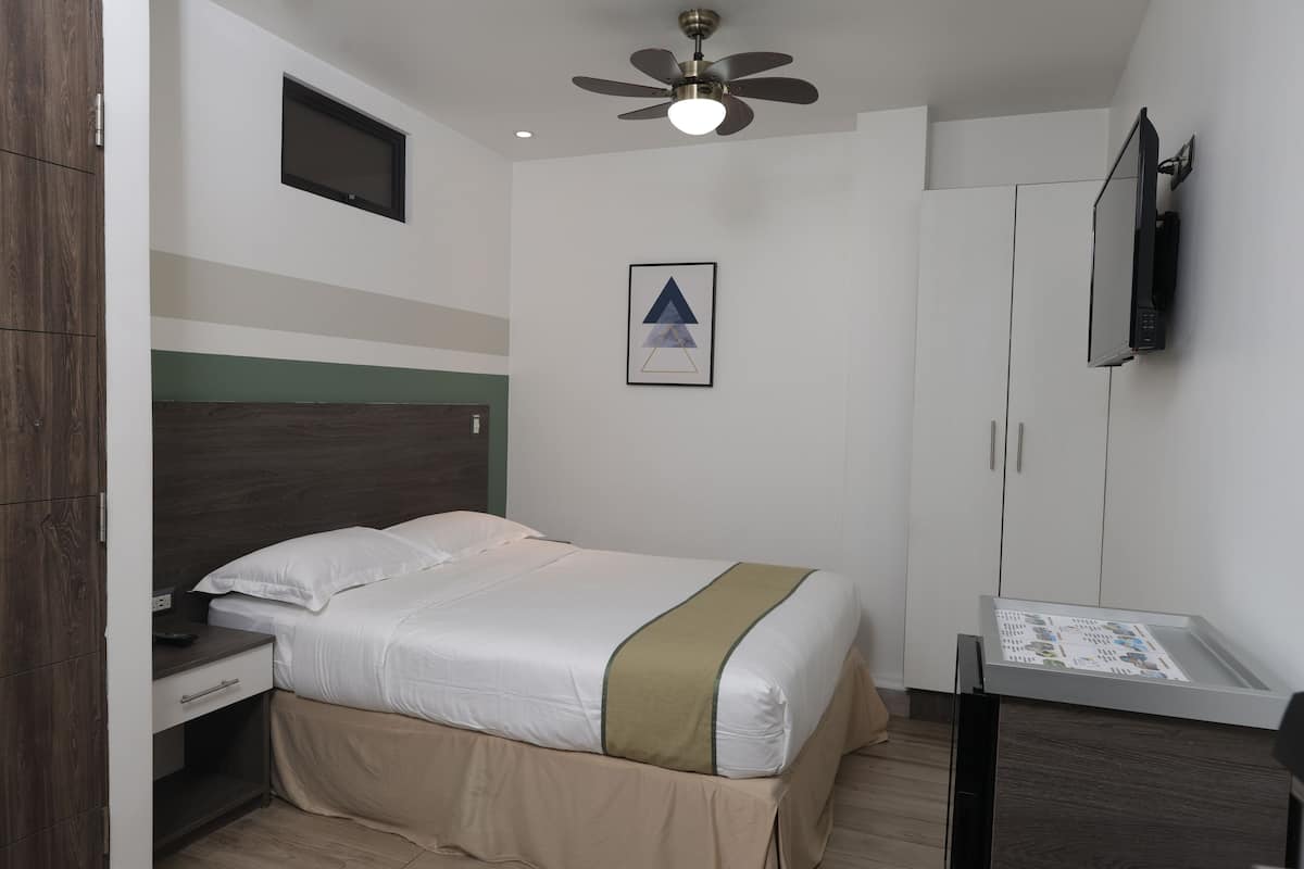 Double Room | Minibar, in-room safe, individually decorated, individually furnished