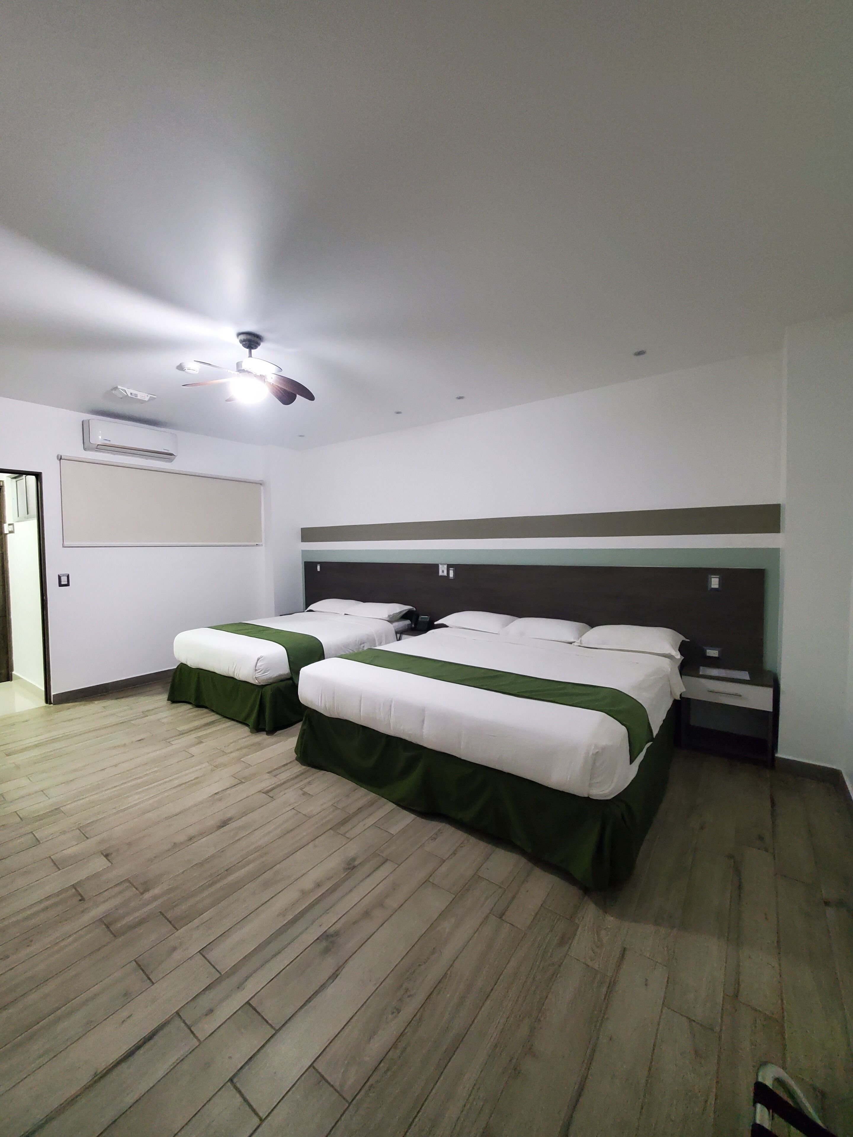 deluxe quadruple room | 1 bedroom, minibar, in-room safe, individually decorated