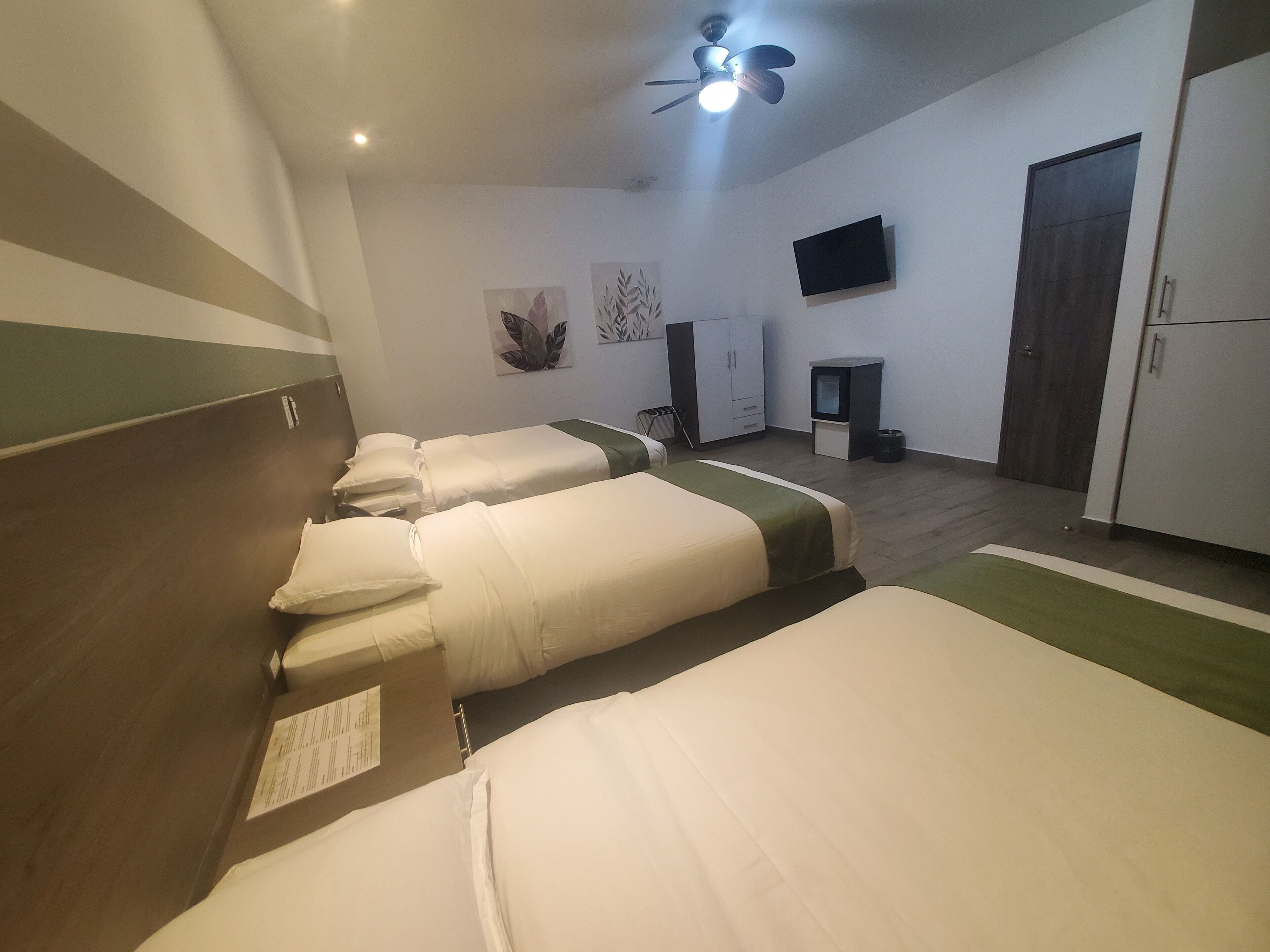 deluxe quadruple room | 1 bedroom, minibar, in-room safe, individually decorated