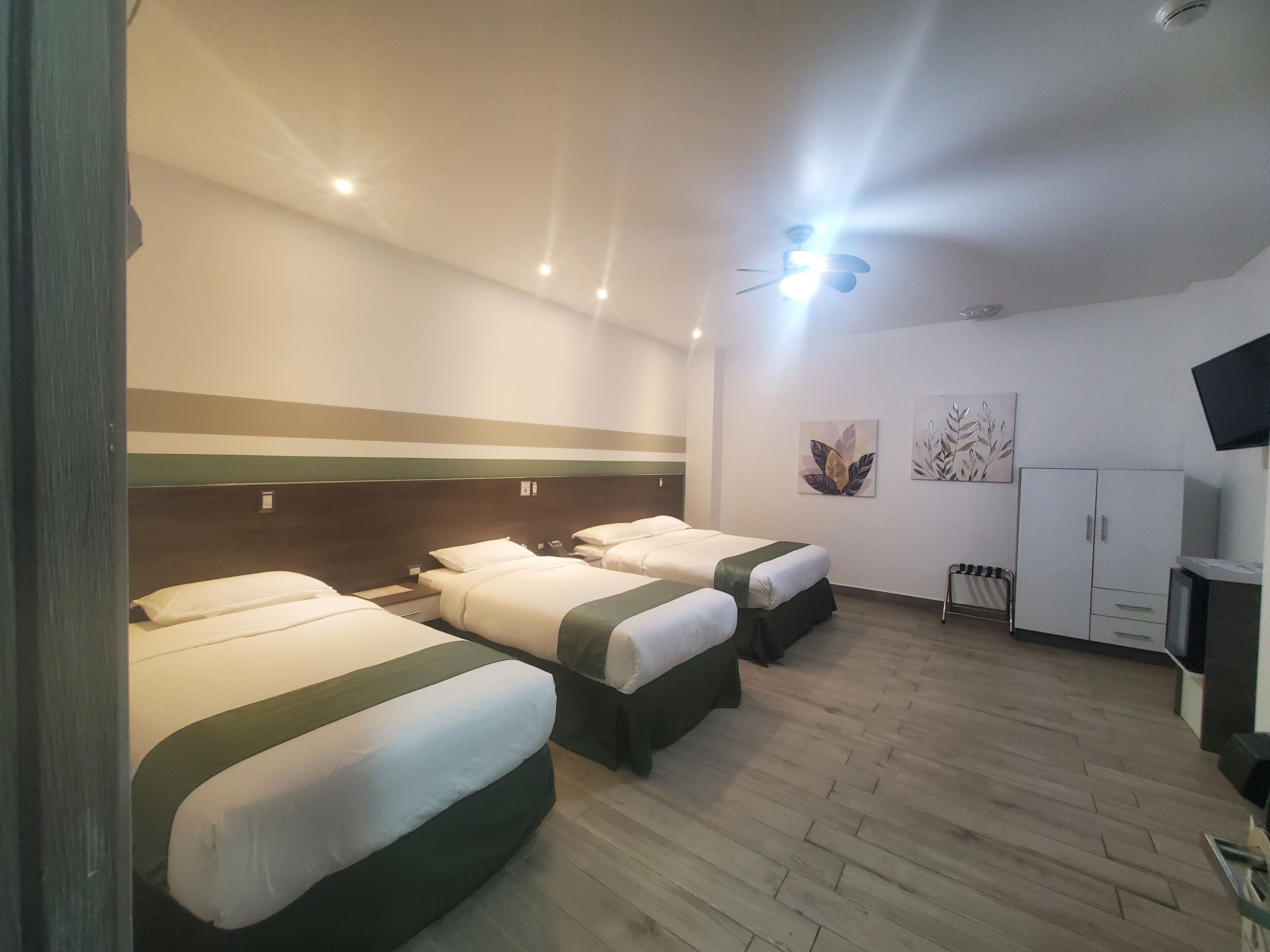 deluxe quadruple room | 1 bedroom, minibar, in-room safe, individually decorated