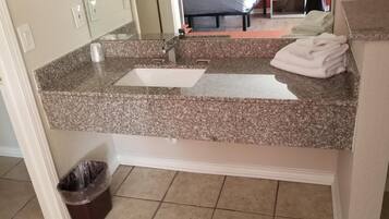 Bathtub, hair dryer, towels