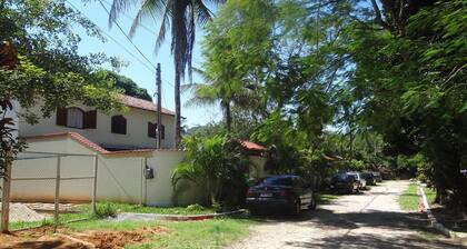2,500m2 property with a two-story house, swimming pool, lake, soccer field, and barbecue area.