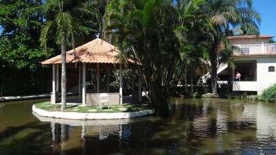 2,500m2 property with a two-story house, swimming pool, lake, soccer field, and barbecue area.