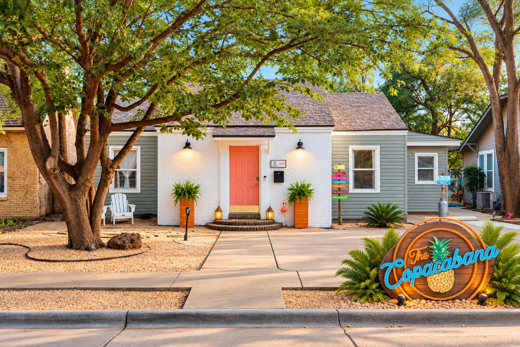A residential property with a front porch, a red door, and a sign for 'The Cocabana.'
