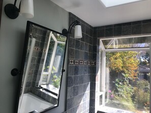 Combined shower/tub, hair dryer, towels, soap