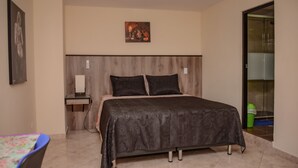 A bedroom with a bed, bedside table, and a wall-mounted artwork. - 5 Bed PH ENTIRE ROOF HOT TUB ELEVATOR Private roof Guests with Photo ID (Medellin)