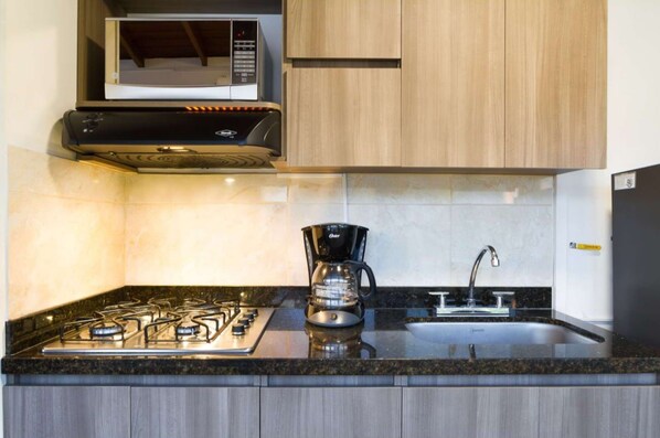 Fridge, microwave, stovetop, coffee/tea maker