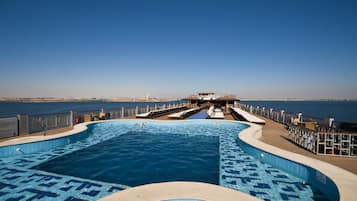 Outdoor pool, pool umbrellas, pool loungers