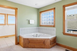 Combined shower/bathtub, towels, soap, toilet paper - The After Glow | 940 ft from the beach | Private Pool, Hot Tub (Nags Head)
