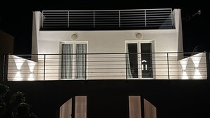 A two-story building with a balcony, large windows, and a door. - Bella Casa Srima Comfort  (Vodice)