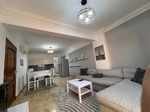 Deluxe Two Bedroom Chalet | Living room | 32-inch LCD TV with satellite channels