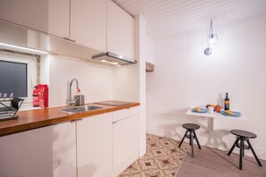 Fridge, stovetop, electric kettle, toaster