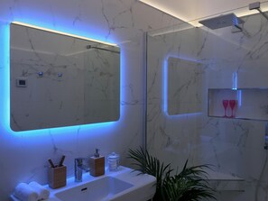Combined shower/tub, hair dryer, towels, soap