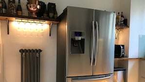 A stainless steel refrigerator with a water dispenser, a built-in microwave, and a trash bin. - Luxurious Vacation Rental 10 mins walk from Epernay town centre (Épernay)