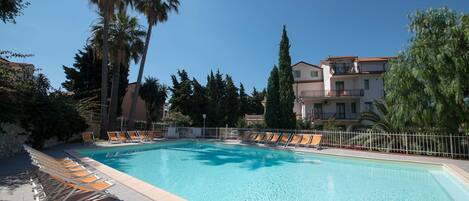 Seasonal outdoor pool, open 9:00 AM to 7:00 PM, pool umbrellas