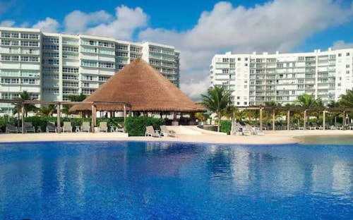 Relax and Recharge in lovely beachfront apartment.  Fantastic location