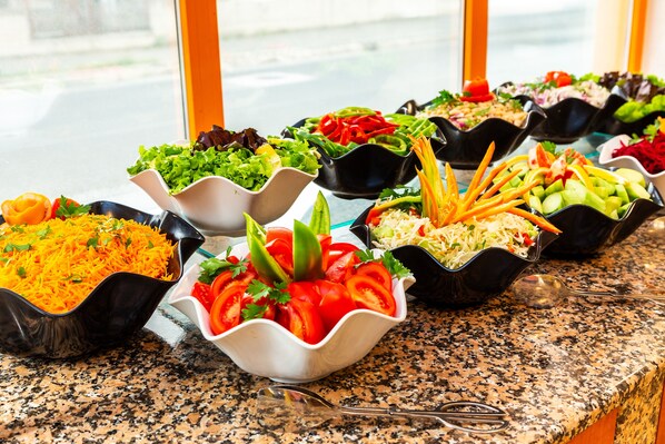 A buffet table with various salads and dishes. - Complex Sunrise All Inclusive (Sunny Beach)