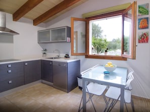 Enjoy meals in the compact kitchen with a dishwasher and dining area.