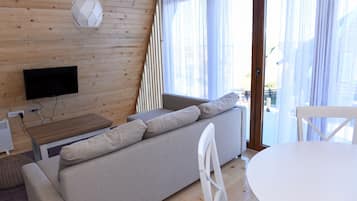 Apartamento, 1 habitación | Zona de estar | Una televisión de pantalla plana