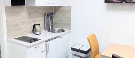 Fridge, microwave, stovetop, coffee/tea maker