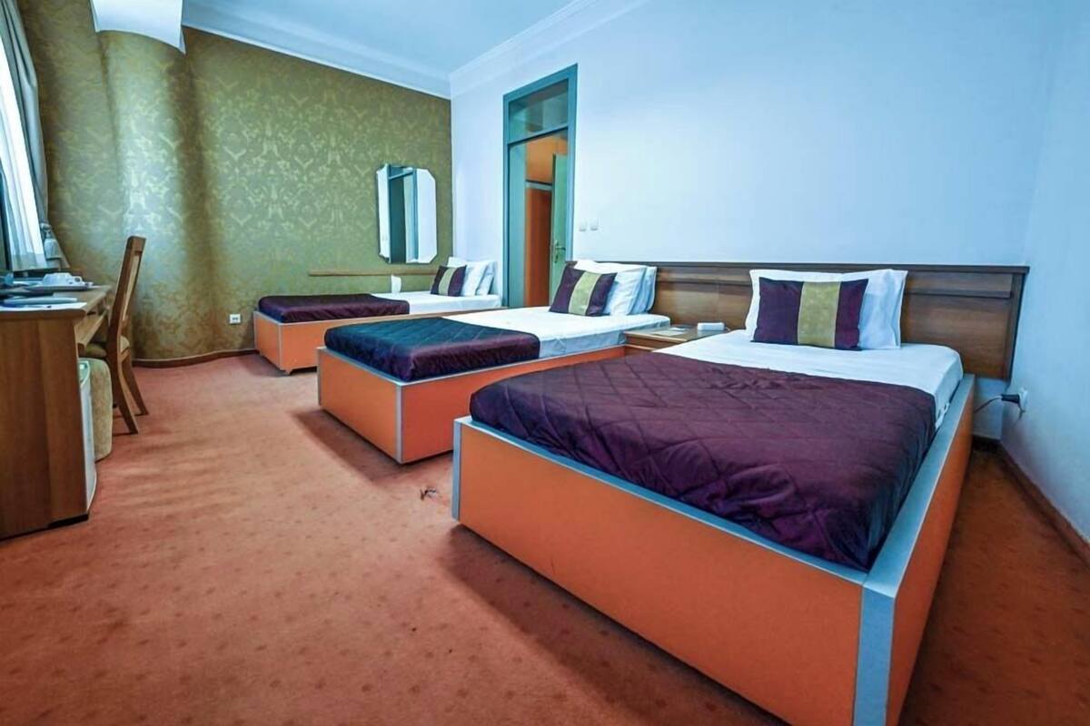 Economy Triple Room | 1 bedroom, minibar, in-room safe, desk