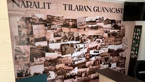 A wall with a collage of historical photos at the Naraliit Hotel in Tilaran, Guancast. - Hotel Naralit (Tilaran)
