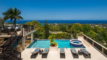 Outdoor pool, an infinity pool, sun loungers