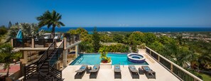 Outdoor pool, an infinity pool, pool loungers - An Ultra-Luxurious Resort Style Ocean View Villa. Optional Yacht, Fully Staffed! (Discovery Bay)