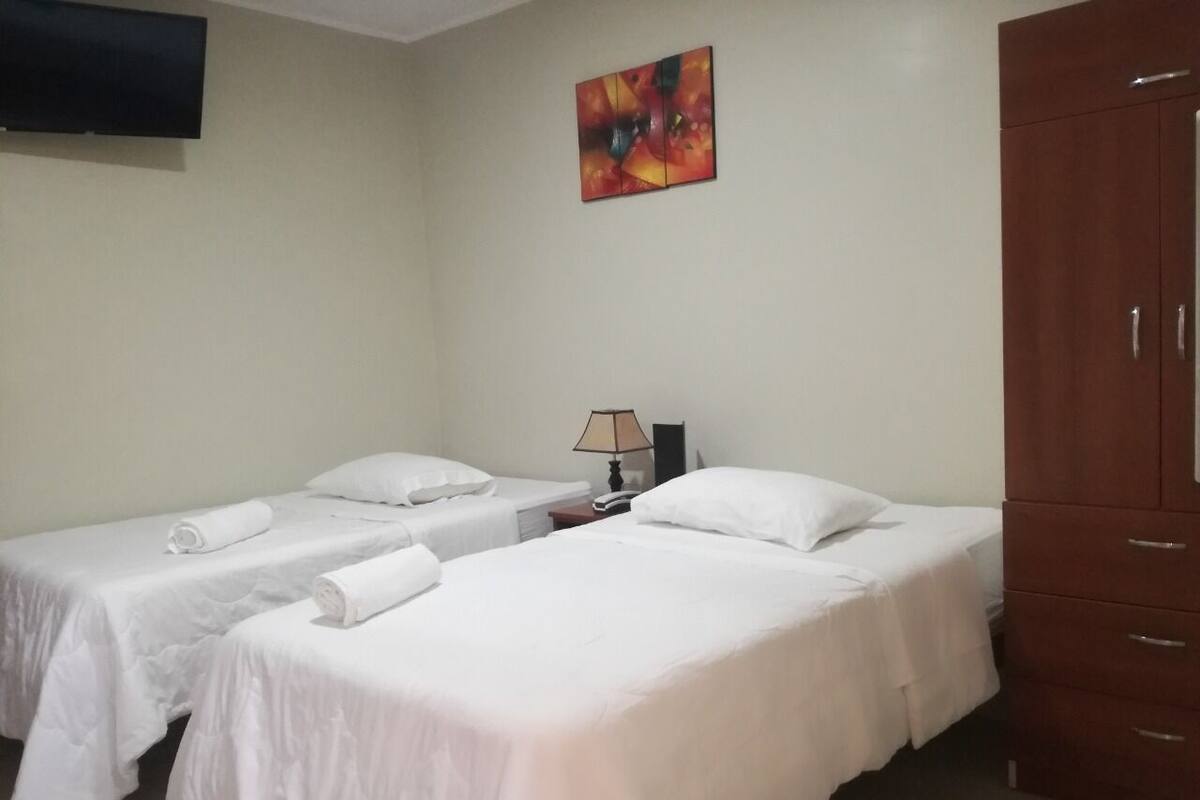 Laptop workspace, blackout curtains, free WiFi, bed sheets