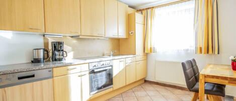 Fridge, oven, dishwasher, cookware/dishes/utensils