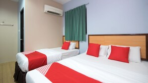 A hotel room with two beds, each with red and white bedding, a wooden headboard, and a green curtain. - Hotel O Hotel Oriental (Kota Kinabalu)