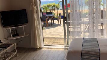 Panoramic Triple Room, Ocean View, Beachfront | Premium bedding, individually decorated, individually furnished, desk