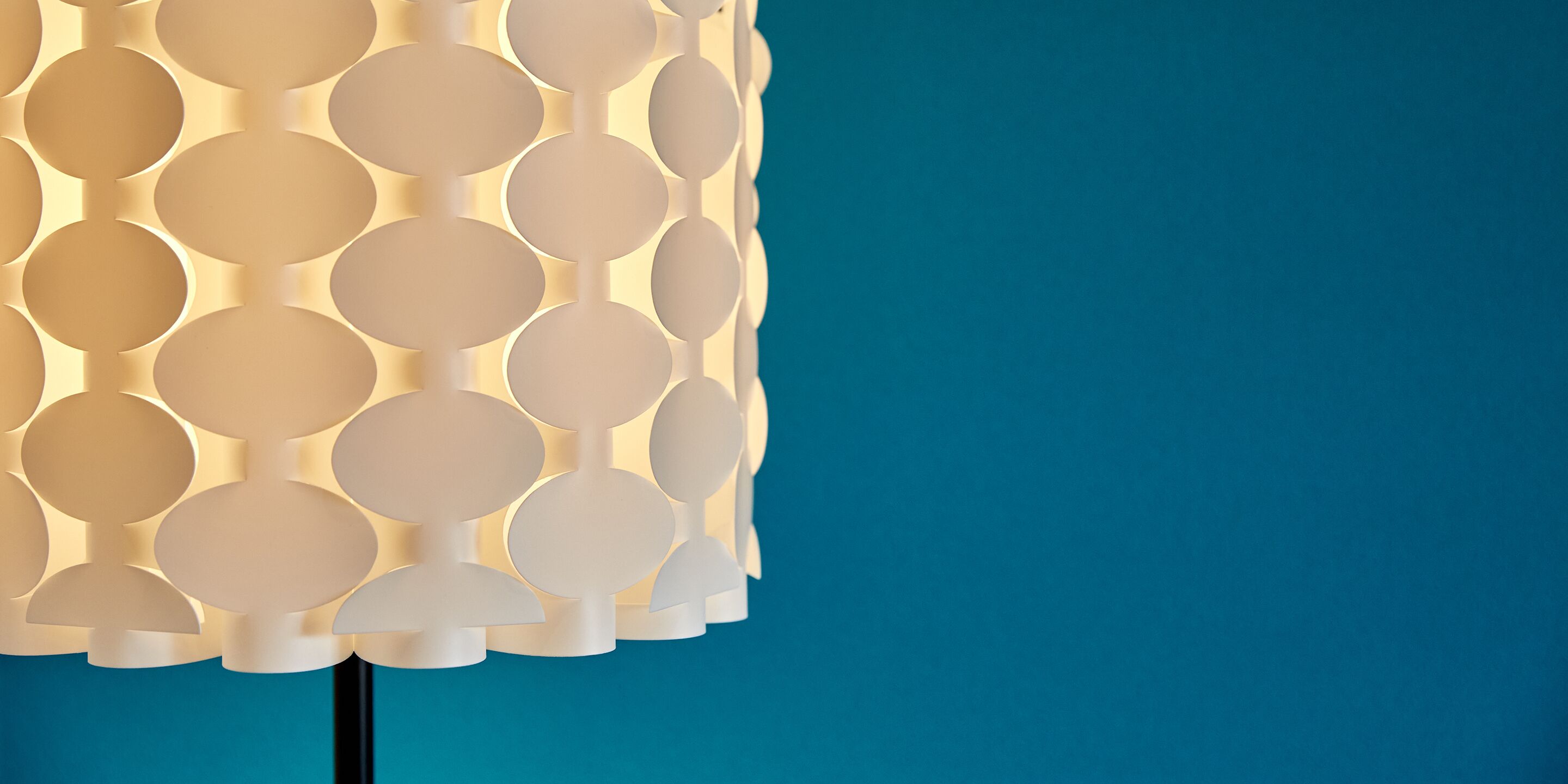 A wall with a circular pattern design.