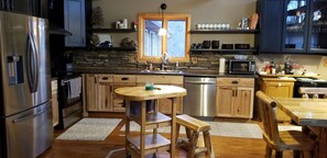 Fridge, microwave, oven, stovetop - Exclusive 4 Bedroom Home on 10 Acres, Hot Tub, Pond in Heart of Trail System (Dunbar)