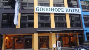 The exterior of the Goodhope Hotel with a signboard, entrance doors, and a parking meter. - Good Hope Hotel Kelana Jaya (Petaling Jaya)