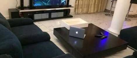 Apartment, 3 Bedrooms | Living room | 32-inch flat-screen TV with cable channels, TV