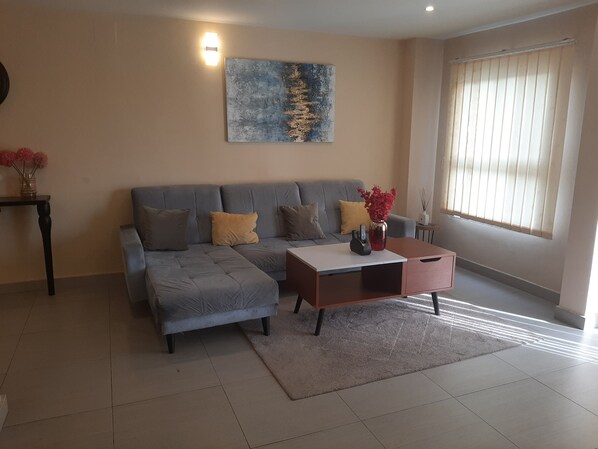 Economy Apartment, 1 Bedroom | Living area | 32-inch flat-screen TV with cable channels, TV