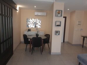 Economy Apartment, 1 Bedroom | Living area | 32-inch flat-screen TV with cable channels, TV