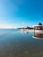 Outdoor pool, open 8:00 AM to 8:00 PM, sun loungers