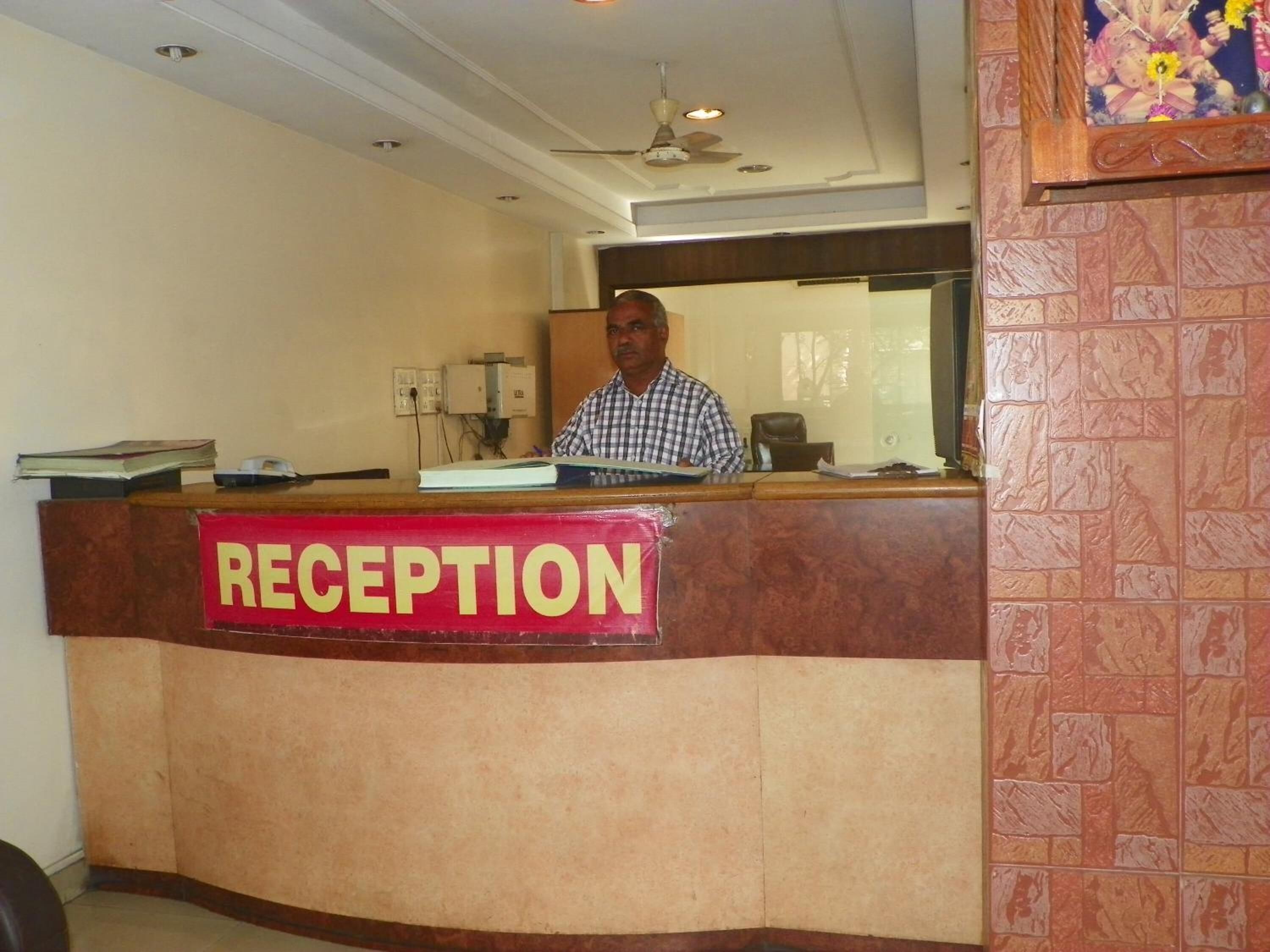 A reception desk with a sign that reads "RECEPTION".