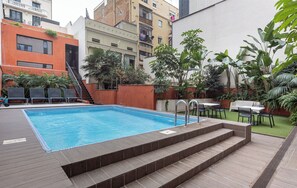 Outdoor pool, open 9:00 AM to 10:00 PM, pool umbrellas, pool loungers