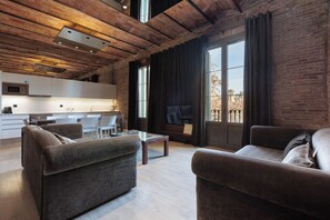 Deluxe Apartment | Living area | 52-inch flat-screen TV with digital channels - Enjoybcn Miro Apartments (Barcelona)