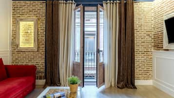 Superior Apartment | Living area | Flat-screen TV