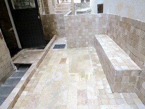 A tiled bathroom with a shower area and a small window. - Istanberry - Pera Apartments (Istanbul)