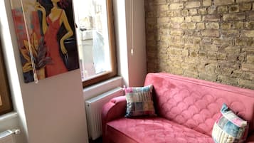 Superior Apartment (1st Floor) | Living room | 32-inch flat-screen TV with satellite channels, TV