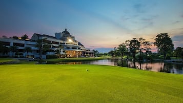 Enjoy a round of golf on our well-maintained putting green, surrounded by a serene lake and lush trees.