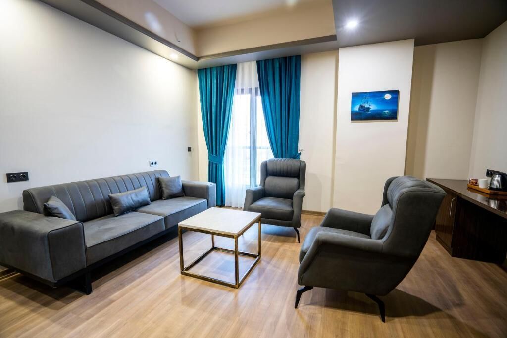 Suite | Living area | 50-inch LCD TV with cable channels