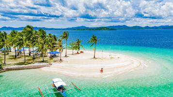 Beach shuttle, beach umbrellas, beach towels, kayaking